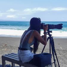 photograph filming on the beach