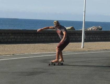 Surf coach showing correct surfskate moves