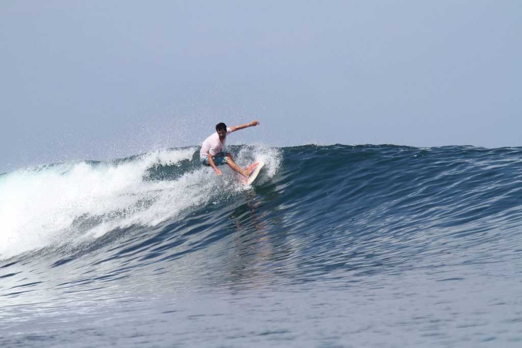 Surf teacher on a wave